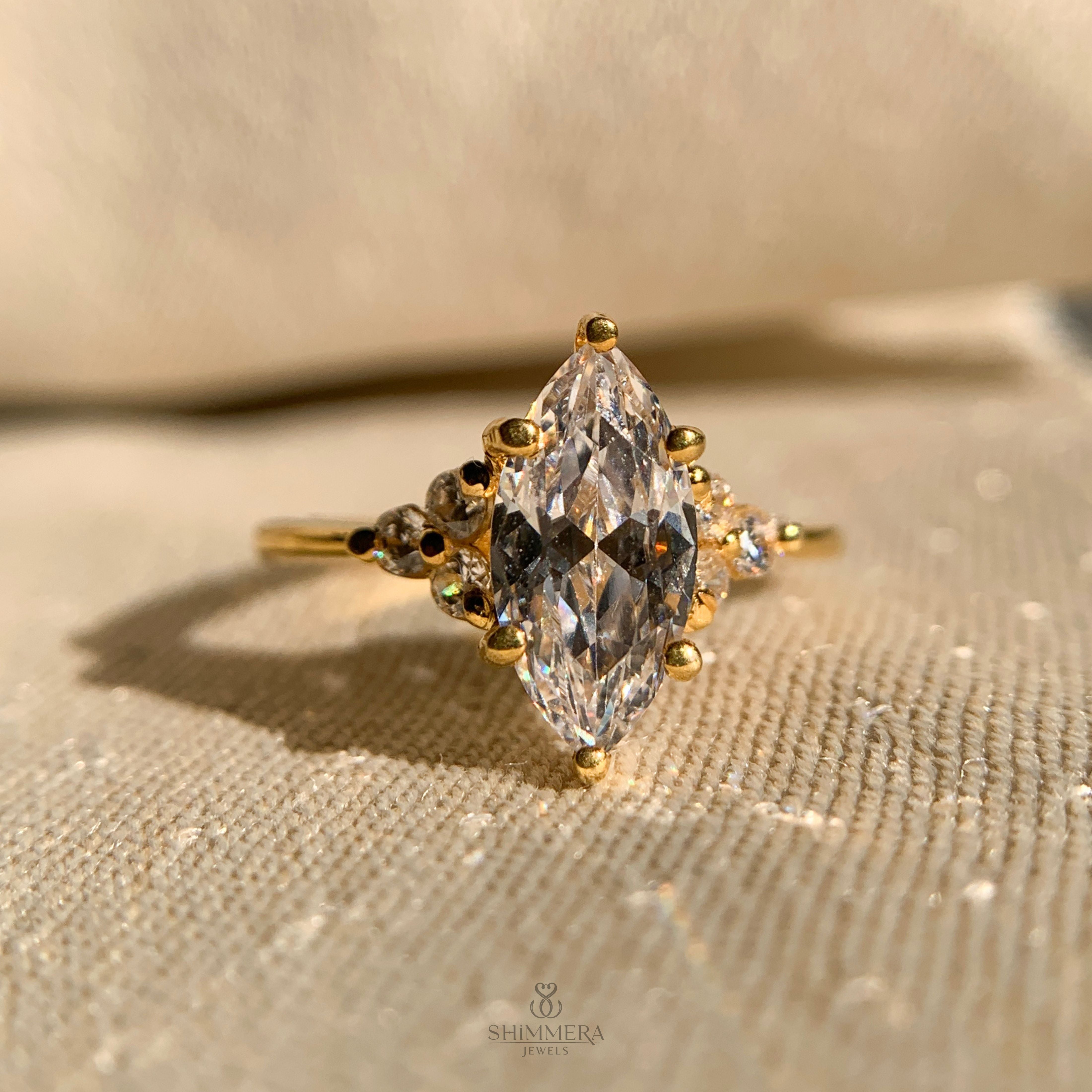 Luxury pear cut engagement ring with side stone diamond accents